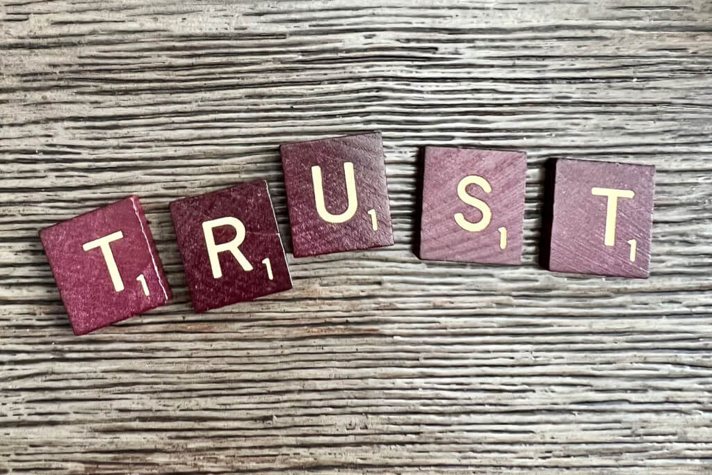 Their six tiles spelling the word trust